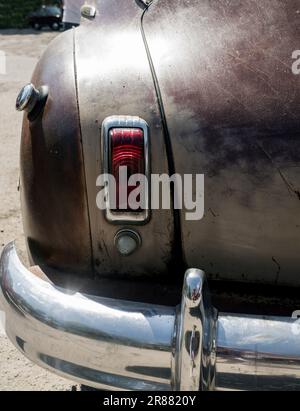 old rusty classic car. Vintage retro automobile. Back view Stock Photo