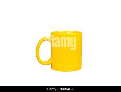 Yellow coffee mug isolated on a white background Stock Photo