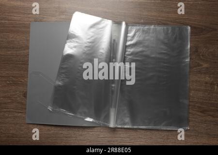 File folder with punched pockets on wooden table, top view Stock Photo