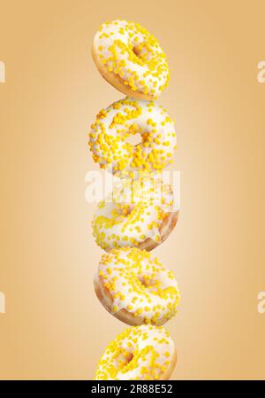 Tasty donuts with sprinkles on light orange background Stock Photo