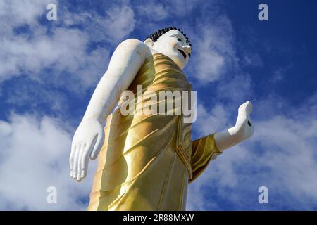 Standing Buddha at Wat Phra That Doi Kham, the Lucky Temple in Chiang Mai, Thailand. Stock Photo