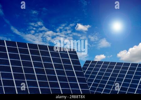 solar panels with blue sky and sun Stock Photo