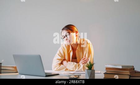 Work fatigue remote sleeping overworked woman Stock Photo