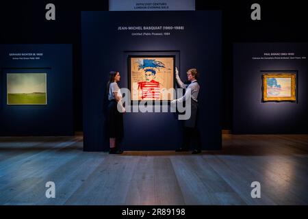 London, UK. 20 Jun 2023. Jean-Michel Basquiat, Untitled (Pablo Picasso) (1984, estimate: £4,500,000-6,500,000) with GERHARD RICHTER (B. 1932), Grünes Feld (Green Field), Painted in 1969, Estimate : GBP 4,000,000 - GBP 6,000,000 and PAUL SIGNAC (1863-1935), Calanque des Canoubiers (Pointe de Bamer), Saint-Tropez, Painted in 1896, Estimate: GBP 5,500,000 - GBP 8,000,000 - Preview of Christie's 20th/21st Century: London Evening Sale. It showcases the dynamism of portraiture across the centuries, coinciding with London's National Portrait Gallery re-opening to the public. - Credit: Guy Bell/Ala Stock Photo