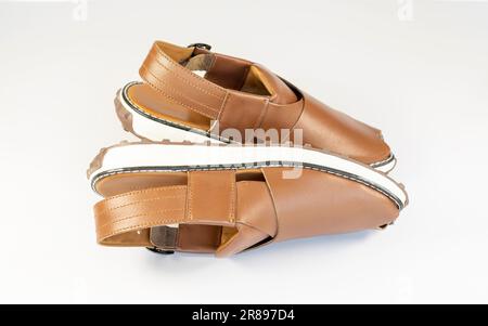 Peshawari traditional leather chappal or flipflop footwear isolated on white background Stock Photo