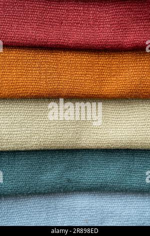 Different colored fabric samples for curtains or furniture made of natural material to choose the best for the interior design at home, full frame, co Stock Photo