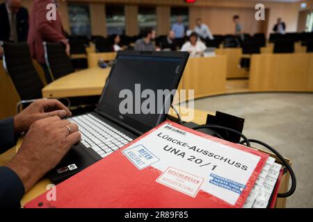 Wiesbaden, Germany. 20th June, 2023. 'Lübcke Committee UNA 20/1' is written on a folder during what is expected to be the last meeting of the investigative committee in the Hesse state parliament on the murder of Kassel district president Lübcke. The Lübcke investigation committee of the Hessian parliament has met during three years. Its first meeting was on June 30, 2020. Credit: Sebastian Christoph Gollnow/dpa/Alamy Live News Stock Photo