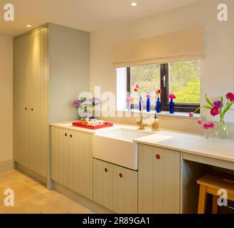 Contemporary country kitchen complete with white Belfast sink in a UK home Stock Photo
