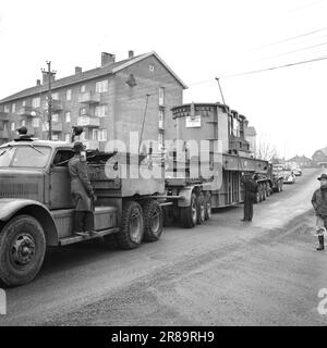 Current 57-3-1960: Giant on city tour Forty wheels rolled in unison from Hasle to Ulven in Oslo the other day. They carried out a historic job: The largest Norwegian-built transformer to date – a giant of 205 tonnes – was transported from Per Kure A/S to the lighting company's facility at Ulven, where it will help with the power supply. The transformer, which produces 161,000 kilovoltampères, is 9.6 meters long and 5.7 meters wide. Oslo Lysverker had called in reinforcements for the large transport and no less than two drivers were in business. They received their driving orders from the comma Stock Photo