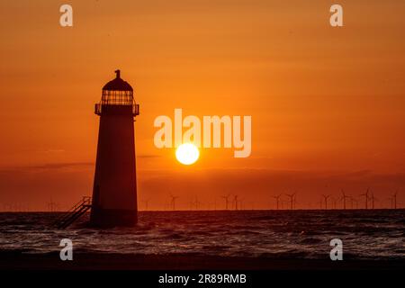 Sunset over Point of Ayr lighthouse, Talacre, North Wales Stock Photo