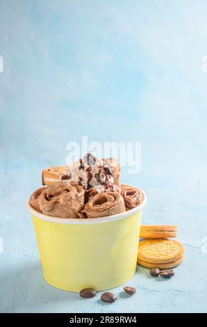 Delicious rolled wafer cookies on wooden table Stock Photo - Alamy