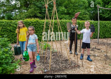 Netherlands, Gendt, children worked in a vegetable garden and bring back the tools they worked with. Stock Photo