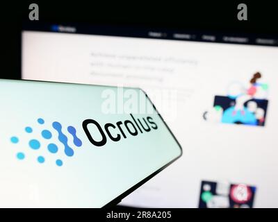 Mobile phone with logo of American document automation company Ocrolus Inc. on screen in front of website. Focus on center-left of phone display. Stock Photo