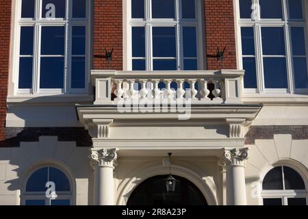 A view of a richly decorated balcony in a historic building maintained in the Neo-Gothic style. Stock Photo