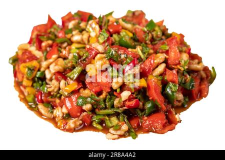 Gavurdagi salad. Walnut salad  isolated on white background. Healthy salad prepared with tomatoes, peppers, cucumbers, onions, pomegranate syrup, oliv Stock Photo