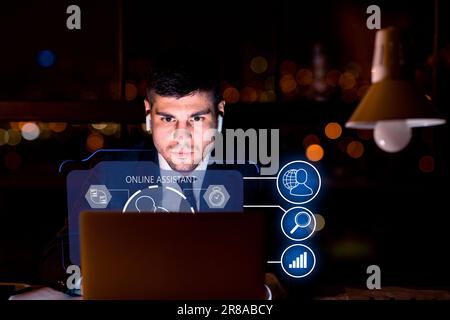 Young man wearing suit working on laptop, using chatbot Stock Photo