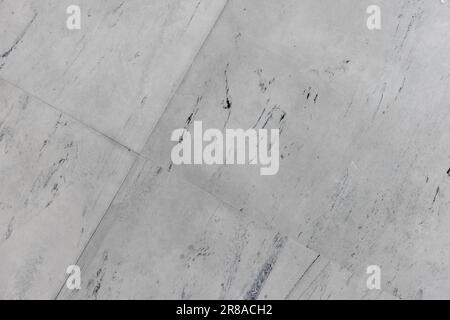 Texture of and indoor flooring made of square wear-resistant rubber tiles, background photo Stock Photo