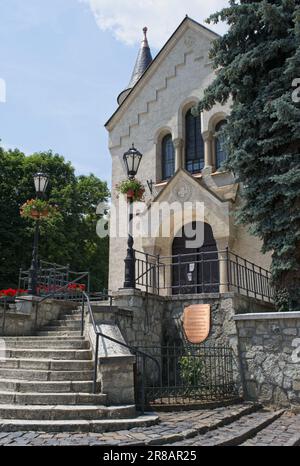 Tokaj, Hungary - Jun 20, 2023: A walking in the center of Tokaj city in northeastern Hungary in a sunny spring day. Heart of Jesus Church. Stock Photo