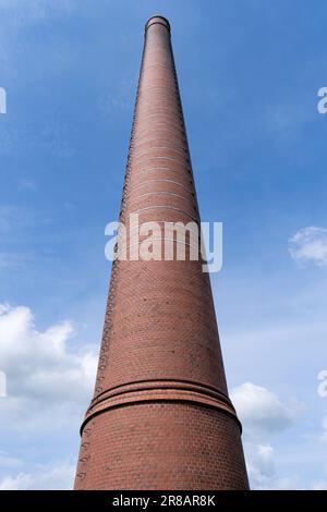 industrial chimney against blue sky Stock Photo