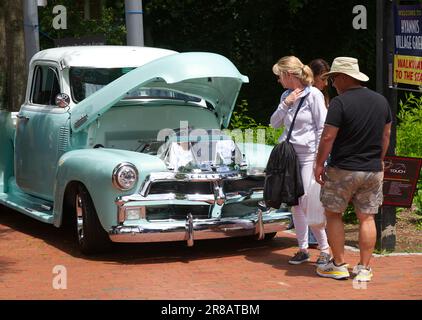 Father's Day Auto Show - Hyannis, Massachusetts, Cape Cod - USA. Looking at a pickup truck from the 50's. Stock Photo