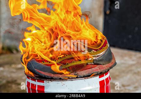 Splints On Fire Burning sports sneakers on fire. Shoes on fire Stock Photo - Alamy
