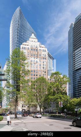 The 1930 Marine Building with the MNP Tower behind as seen from route 7A, Vancouver, Canada Stock Photo