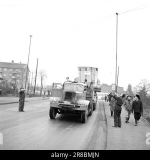 Current 57-3-1960: Giant on city tour Forty wheels rolled in unison from Hasle to Ulven in Oslo the other day. They carried out a historic job: The biggest Norwegian-built transformer to date – a giant of 205 tonnes – was transported from Per Kure A/S to the lighting company's facility at Ulven, where it will help with the power supply. The transformer, which produces 161,000 kilovoltampères, is 9.6 meters long and 5.7 meters wide. Oslo Lysverker had called in reinforcements for the large transport and no less than two drivers were in business. They received their driving orders from the comma Stock Photo