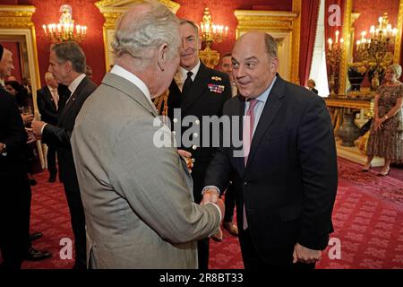 King Charles III (right) shakes hands with Rod Stewart as they attend ...