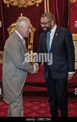 King Charles III (right) shakes hands with Rod Stewart as they attend ...