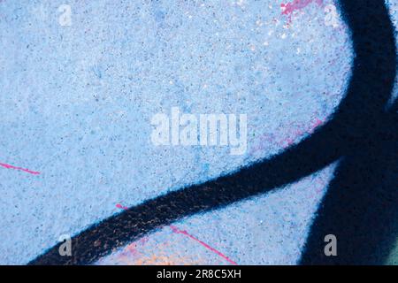 Colorful street art graffiti background with abstract drawings. Navy blue lines on light blue background with pink, white drips, flows, streaks of Stock Photo