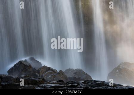 The Bousra waterfall with long exposure in the daylight in Cambodia Stock Photo