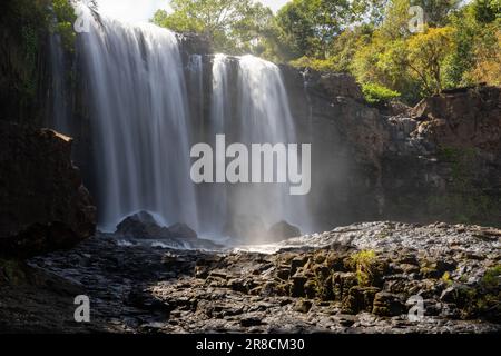 The Bousra waterfall with long exposure in the daylight in Cambodia Stock Photo