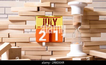 July 21st. Day 21 of month, wooden color calendar on office background. Summer time. Empty space for text. Stock Photo