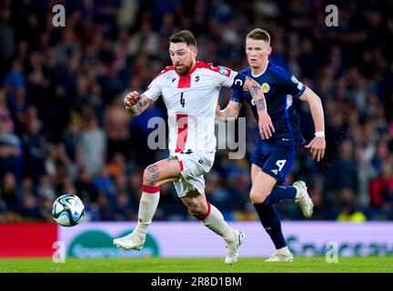 Georgia's Guram Kashia (left) controls the ball during the UEFA Euro 2024 Qualifying Group A match at Hampden Park, Glasgow. Picture date: Tuesday June 20, 2023. Stock Photo