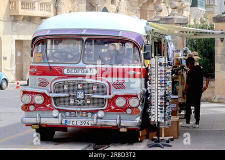 Vintage Gozo bus with Maltese bodywork constructed on a Bedford engine and chassis, converted into a mobile tourist souvenir shop, parked in Valletta. Stock Photo