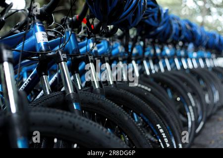 A number of bicycles are parked neatly at the Sentul roundabout during a leisurely cycling event on a sunny morning Stock Photo