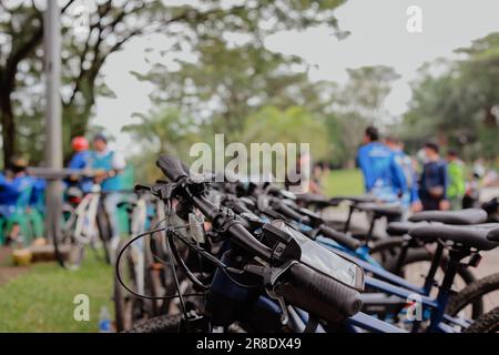 A number of bicycles are parked neatly at the Sentul roundabout during a leisurely cycling event on a sunny morning Stock Photo