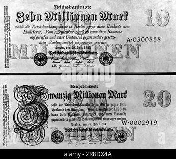 Berlin, Germany: 1923. A German ten and twenty million mark bill in July of 1923. They are the highest denomination ever printed, and Germany expects them to help her evade the present money scarcity. The exchange rate later in December 1923, was between 3.4 to 5.72 billion marks to the dollar. In January of 1923 it was between 7,000 to 48,000 marks to the dollar. Stock Photo