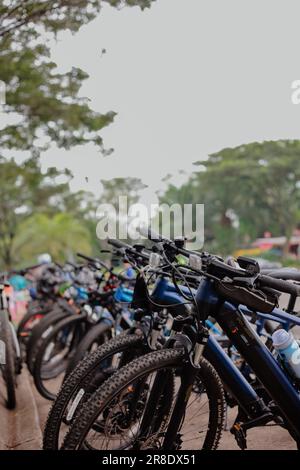 A number of bicycles are parked neatly at the Sentul roundabout during a leisurely cycling event on a sunny morning Stock Photo