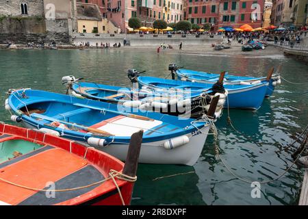 Vernazza Italy - April 24 2011; Quaint European boats moored or tied up in Cinque Terre fishing village and popular tourist destination. Stock Photo