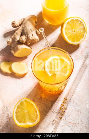 Ginger and lemon refreshing lemonade or cocktail, immunotherapy drink Stock Photo
