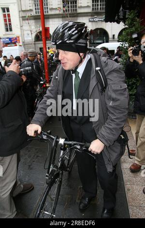 London Mayor Boris Johnson in his cycling gear in Chinatown in central London Stock Photo