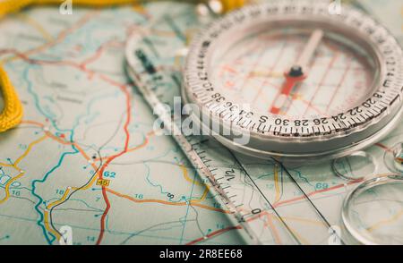 Modern compass on a map. Travel concept. Stock Photo