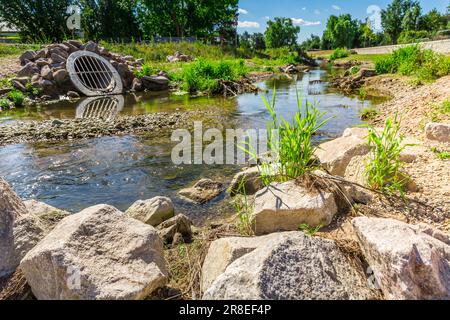 Water draining pipe preventing from overflooding farm and urbanization land. Stock Photo