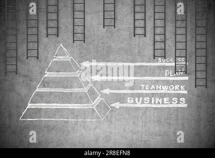 drawing structure  pyramid of success on concrete wall and many black ladder Stock Photo