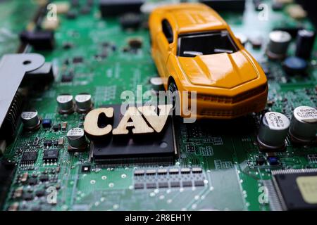 A photograph that expresses the image of a Connected Autonomous Vehicle using a motherboard. Stock Photo