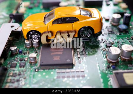A photograph that expresses the image of a Connected Autonomous Vehicle using a motherboard. Stock Photo