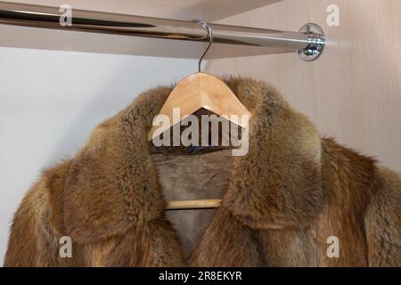 hangs on the hanger in the closet fur for the winter Stock Photo