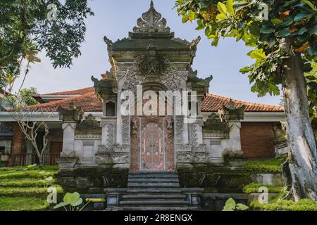 Balinese hindu temple building. Indonesian architecture of holly places, ancient bali carved stone temple with entrance steps Stock Photo