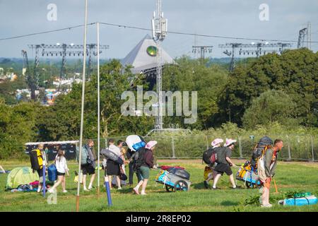 First arrivals at the 2023 Glastonbury festival with the Pyramid stage in the background. Wednesday, 21 June, 2023. Photo: Richard Gray/Alamy Live News Stock Photo